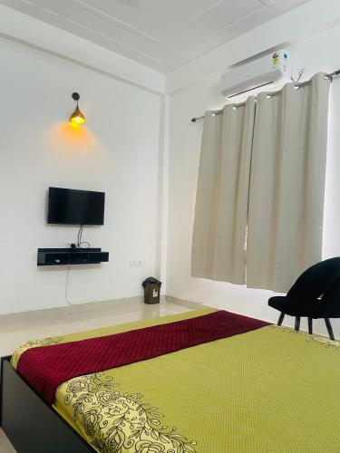 TV o dispositivi per l'intrattenimento presso Atulyam Stays Sushant Golf City