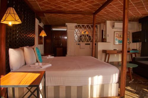 a bedroom with a large bed in a room at Casa Lisa in Acapulco