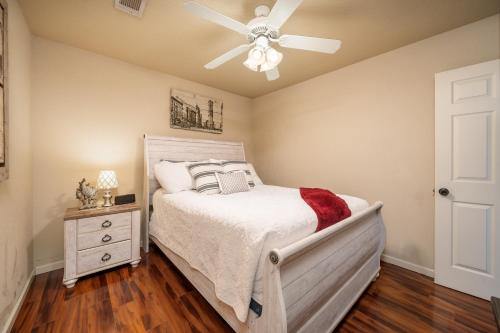 a bedroom with a bed and a ceiling fan at Ember’s View, Spa City Jewel- Lovely Lake Condo in Hot Springs