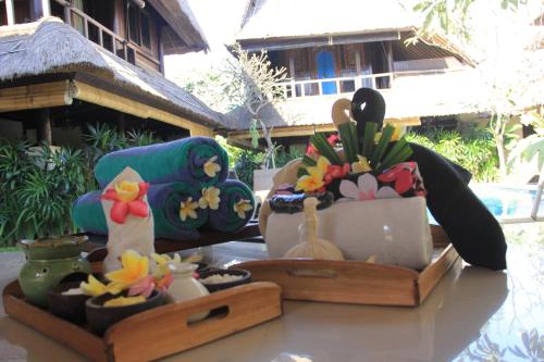 a table with a tray of items on it at Radiant Jepun Villa in Legian