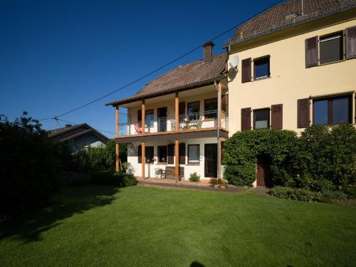 a large house with a lawn in front of it at Ferienhaus an der Austwies in Nonnweiler