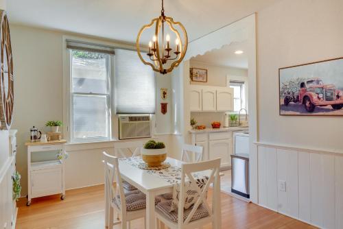a kitchen and dining room with a white table and chairs at Historic Home 3 Blocks to Whiskey Row and Downtown in Prescott