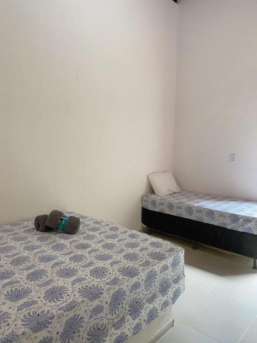 Un pat sau paturi într-o cameră la Chalé Duplo