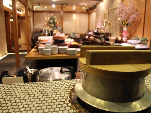 a kitchen with a table with a cake on it at Hotel Lexton Kagoshima in Kagoshima