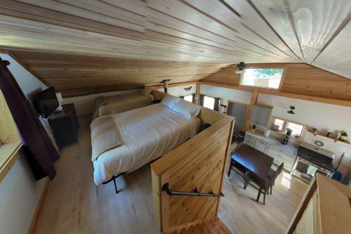 an overhead view of a bedroom in a tiny house at Whale Pass Adventure Property 