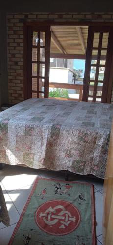 מיטה או מיטות בחדר ב-Casa da Barra da Ibiraquera