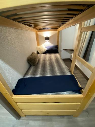 a bedroom with a bunk bed in a room at Antarès Location Avoriaz in Avoriaz