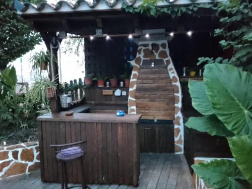 a drink station in a garden with a giraffe house at Casa Cueva El Almendro in Pegalajar