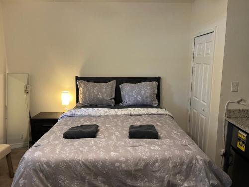a bedroom with a bed with two pillows on it at ZenHomes in Brandon near Tampa Valrico Seffner in Brandon