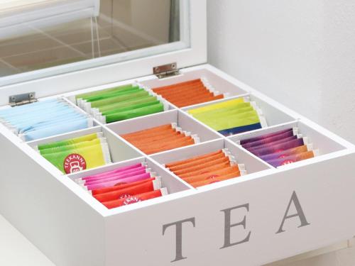 a white box filled with different colored pencils at LIGHTPLACE • Design • Boxspring • Balkon • 2 Smart TV •Innenstadt in Braunschweig