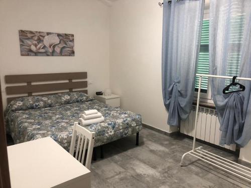 Säng eller sängar i ett rum på Il grappolo -affittacamere-