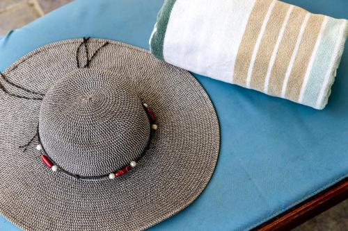a hat sitting on top of a blue table at Oceanfront - Villa Port of Call - in Kralendijk