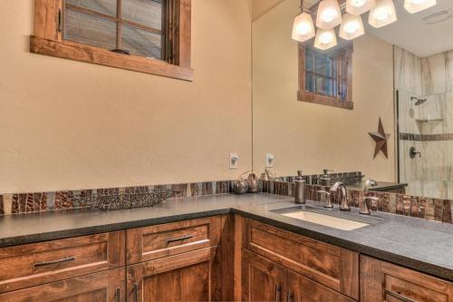 a bathroom with a sink and a mirror at Trailmere 1 in Sunriver