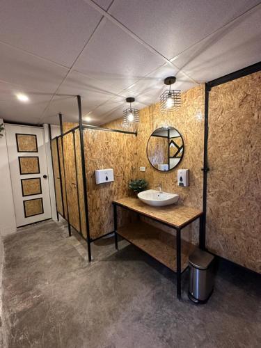 a bathroom with a sink and a mirror at CASA CRISTOBAL Siete Cuartones in Cusco