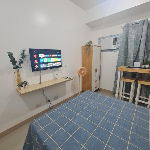Кровать или кровати в номере Homely Green 2 Residences T2