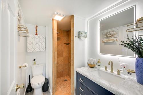 a bathroom with a toilet and a sink and a shower at Eureka Vacation Rental Steps to Creek and Fishing! in Eureka