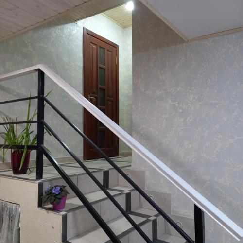 a stairway with a stair railing and a stair case at Три горішки in Yaremche