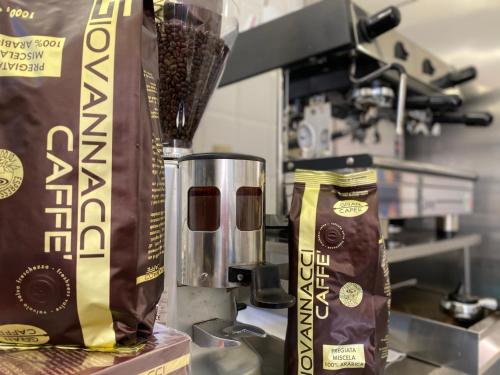 a counter with a bag of chocolate and a blender at Hotel Alba Chiara in Finale Ligure