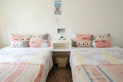 Ένα ή περισσότερα κρεβάτια σε δωμάτιο στο Hotel Posada Edem