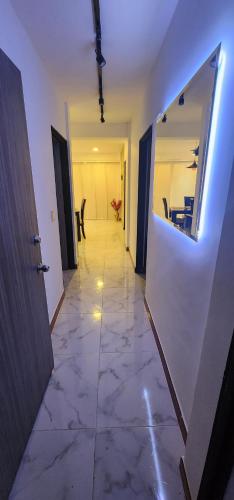 an empty hallway with a room with a hallwayngth H Ubestosbestosbestosbestos at Apartamento Acogedor y Moderno in Santa Rosa de Cabal