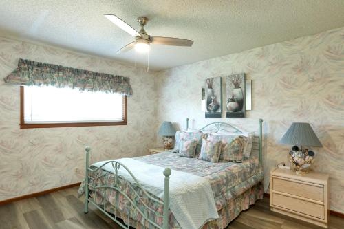 a bedroom with a bed and a ceiling fan at 531 Dolliver in Pismo Beach