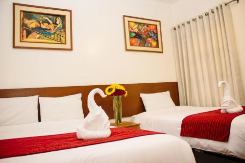 Postel nebo postele na pokoji v ubytování HOSTAL CASA INKAS