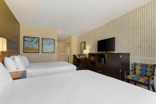Ένα ή περισσότερα κρεβάτια σε δωμάτιο στο Best Western Plus University Inn
