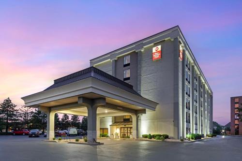 a large building with a canopy in a parking lot at Best Western Plus Chicagoland - Countryside in Countryside
