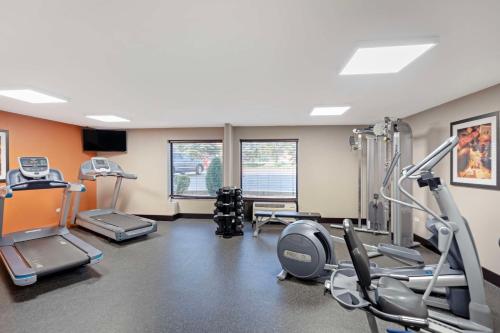 a gym with treadmills and machines in a room at Best Western Plus Chicagoland - Countryside in Countryside
