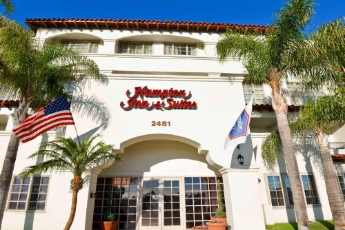 a building with a sign that reads miami inns shuttle at Hampton Inn & Suites San Clemente in San Clemente