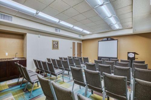 a room with a bunch of chairs and a whiteboard at Hampton Inn & Suites Orlando-East UCF in Orlando