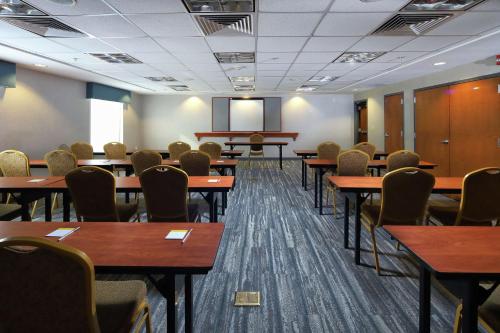 a conference room with tables and chairs and a podium at Hampton Inn & Suites Tucson East in Tucson
