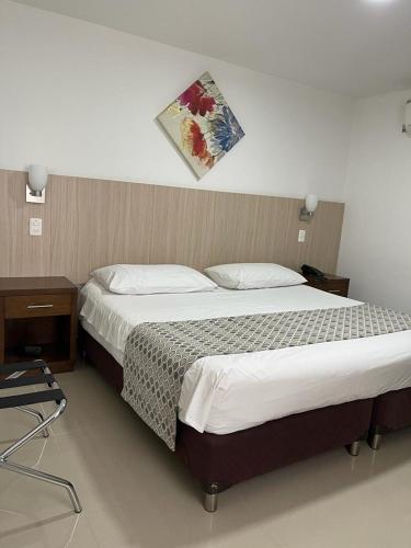 Postel nebo postele na pokoji v ubytování Hotel Juan Maria