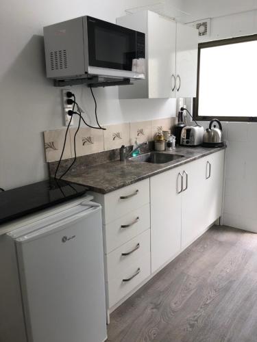 A kitchen or kitchenette at Waikaraka Beach, spacious & very comfortable