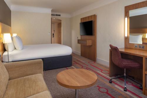 a hotel room with a bed and a desk at Orida Hotels Newbury in Newbury