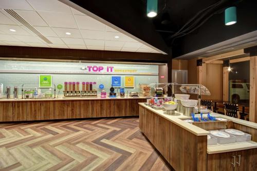a fast food restaurant with a top it counter at Tru By Hilton Raleigh Durham Airport in Morrisville