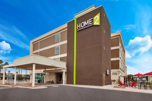 a hotel building with a sign that reads home at Home2 Suites By Hilton Tucson Airport, Az in Tucson
