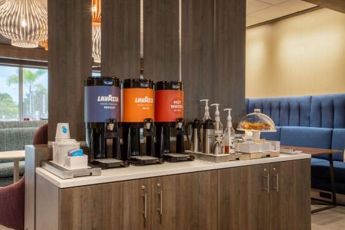 a counter with bottles of wine on top of it at Tru By Hilton Bradenton I-75, FL in Bradenton