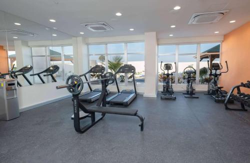 a gym with cardio equipment in a hotel room at Super 8 by Wyndham Manzanillo in Pepillo Salcedo
