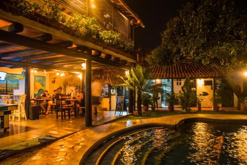 a resort with a swimming pool at night at Dreamer Santa Marta in Santa Marta
