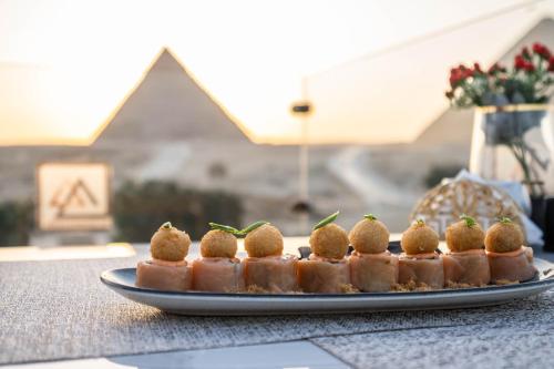 a plate of food sitting on a table at Great Pyramid Inn in Cairo