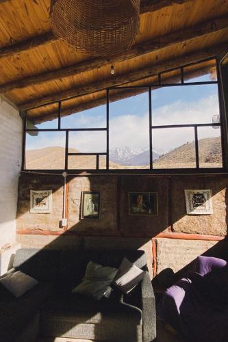a view of a room with a large window at Domos Andinos HostCamp in Potrerillos
