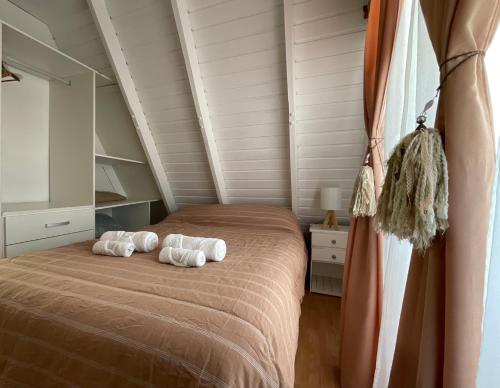 Postel nebo postele na pokoji v ubytování ALPINA Cabaña de Mar - Puerto Madryn