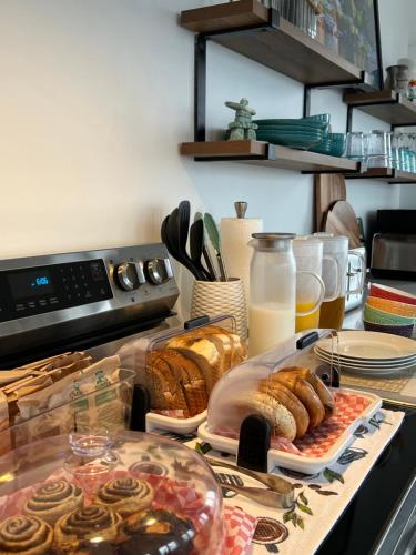 a kitchen counter with bread and pastries on a table at The View suites and breakfast in Triton, Newfoundland in Pilleyʼs Island