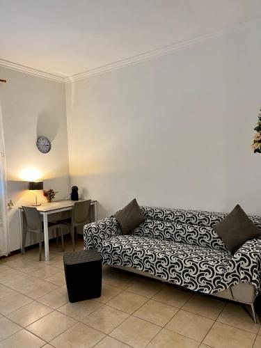 a living room with a couch and a table at Venice Suites in Mestre
