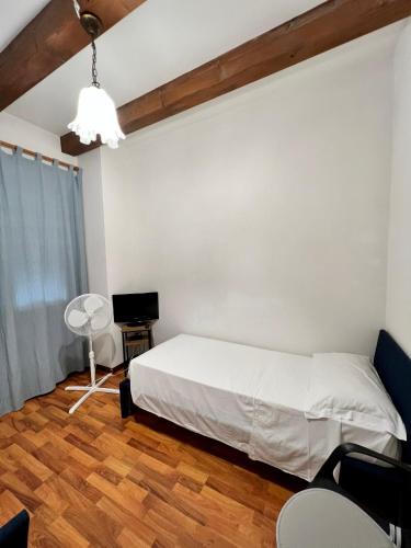 a bedroom with a bed and a table and chairs at Venice Suites in Mestre