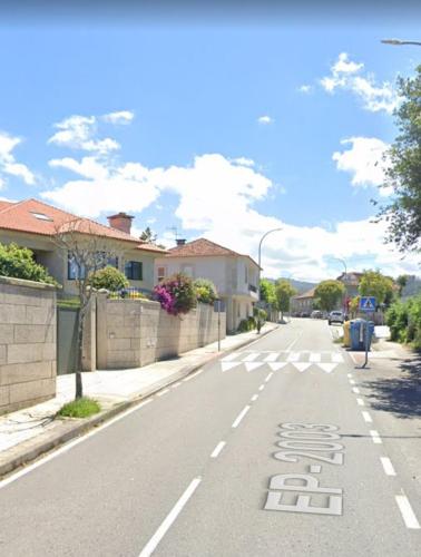 a street with a crosswalk in the middle of the road at PENSION LUCERNA in Vigo
