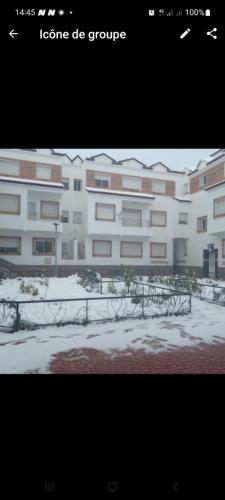 a large white building with snow in front of it at Imouzzar kandar in Imouzzer du Kandar