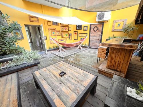 a room with a table and a hammock in it at Varna Cathedral Apartments in Varna City