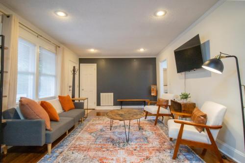 a living room with a couch and a table at Cozy Mauldin Hill by Brick and Home in Simpsonville